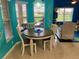 Bright breakfast nook features tile floors, coastal decor, and large windows with natural light at 5005 Pebble Beach Blvd, Winter Haven, FL 33884
