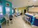 Open-concept space with kitchen island, dining area, and seamless flow to the living room at 5005 Pebble Beach Blvd, Winter Haven, FL 33884
