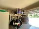 A well-equipped garage with storage; two golf carts allow for easy access to the links at 5005 Pebble Beach Blvd, Winter Haven, FL 33884