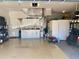 Well-organized garage with built-in cabinets, sink, and space for a golf cart, offering both storage and functionality at 5005 Pebble Beach Blvd, Winter Haven, FL 33884