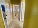 A hallway leading to different rooms in the house at 5005 Pebble Beach Blvd, Winter Haven, FL 33884