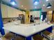 Bright kitchen with white cabinetry, stainless steel appliances, and an open layout at 5005 Pebble Beach Blvd, Winter Haven, FL 33884