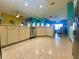 Well-lit kitchen with stainless steel appliances, tiled floors, and open access to the living area at 5005 Pebble Beach Blvd, Winter Haven, FL 33884