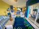 Open-concept living area provides views of the kitchen and outdoor patio at 5005 Pebble Beach Blvd, Winter Haven, FL 33884