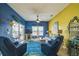 Bright living room with comfortable seating and sliding glass doors to the outside patio at 5005 Pebble Beach Blvd, Winter Haven, FL 33884