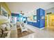 Bright living room features stylish furnishings, vibrant colors, and an open layout connecting to the kitchen at 5005 Pebble Beach Blvd, Winter Haven, FL 33884