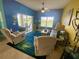 Bright living area features tile floors, coastal decor, and an open view to the outdoors at 5005 Pebble Beach Blvd, Winter Haven, FL 33884