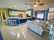 Open concept space with kitchen island, living room seating and lots of natural light at 5005 Pebble Beach Blvd, Winter Haven, FL 33884