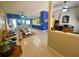 Open-concept living space with blue accent wall, tile flooring, and ceiling fans for added comfort at 5005 Pebble Beach Blvd, Winter Haven, FL 33884