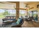 Charming outdoor patio with comfortable seating and a serene view of the lush green lawn at 5005 Pebble Beach Blvd, Winter Haven, FL 33884