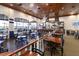 Restaurant and bar area with wood accents, waterfront views, and a relaxed atmosphere for dining and socializing at 5005 Pebble Beach Blvd, Winter Haven, FL 33884