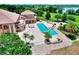 An aerial view shows the home, pool, and surrounding landscape at 501 Adams Barn Rd, Auburndale, FL 33823
