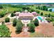 Stunning aerial view of the estate, showcasing the home's layout and extensive grounds at 501 Adams Barn Rd, Auburndale, FL 33823