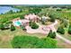 Aerial view of a grand estate with a pool, fountain, and lush landscaping at 501 Adams Barn Rd, Auburndale, FL 33823