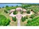 Majestic lakefront estate with circular driveway, mature trees, lush lawn and lovely landscaping at 501 Adams Barn Rd, Auburndale, FL 33823