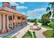 Expansive backyard featuring a large patio, meticulously kept landscaping, and serene lake views at 501 Adams Barn Rd, Auburndale, FL 33823
