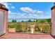 Balcony view of the lush yard and lake surrounded by mature trees at 501 Adams Barn Rd, Auburndale, FL 33823