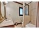 Neutral bathroom with standalone shower and tub combination and decorative window at 501 Adams Barn Rd, Auburndale, FL 33823