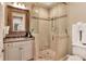Luxurious bathroom featuring a glass-enclosed shower, marble countertops, and elegant fixtures at 501 Adams Barn Rd, Auburndale, FL 33823