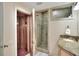 Luxurious bathroom featuring glass enclosed shower, sauna and granite counters offering spa-like experience at 501 Adams Barn Rd, Auburndale, FL 33823