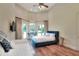 This bedroom boasts a high ceiling, two beds and french doors leading to the backyard at 501 Adams Barn Rd, Auburndale, FL 33823