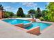 Beautifully designed custom pool featuring unique levels, a spa, and lush landscaping at 501 Adams Barn Rd, Auburndale, FL 33823
