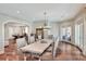 Dining area with seating for eight and view of the game room at 501 Adams Barn Rd, Auburndale, FL 33823