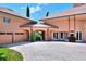 Circular driveway and entrance showcasing an elegant home exterior with a porte cochere at 501 Adams Barn Rd, Auburndale, FL 33823