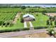 Estate exterior on acreage, complete with a gated entrance and lush landscaping at 501 Adams Barn Rd, Auburndale, FL 33823