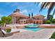 Stunning exterior view of the home with a large pool, patio, and lush landscaping at 501 Adams Barn Rd, Auburndale, FL 33823