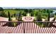 A view from the balcony of the circular driveway with water fountain and lush landscaping at 501 Adams Barn Rd, Auburndale, FL 33823