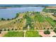 Aerial view showing property outline, lake access, mature trees and privacy at 501 Adams Barn Rd, Auburndale, FL 33823