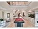 Expansive living room with elegant staircase, marble floors, built in aquarium, and a billiards table at 501 Adams Barn Rd, Auburndale, FL 33823