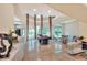 Bright, spacious living room features marble floors, soaring ceilings, and a billiards table at 501 Adams Barn Rd, Auburndale, FL 33823