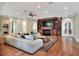 Spacious living room with a decorative fireplace and hardwood floors at 501 Adams Barn Rd, Auburndale, FL 33823
