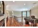 Spacious loft area with hardwood flooring, a foosball table, and ample natural light at 501 Adams Barn Rd, Auburndale, FL 33823