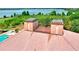 Aerial view of the tile roof and rooftop towers surrounded by lush landscaping at 501 Adams Barn Rd, Auburndale, FL 33823
