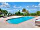 Inviting swimming pool with a spacious patio, offering a serene and luxurious outdoor experience with lake view at 501 Adams Barn Rd, Auburndale, FL 33823