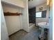 This bathroom features a pedestal sink, glass block window, and separate tub at 502 Canal Dr, Lake Wales, FL 33859