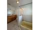 This bathroom offers a classic style with a tub and wooden vanity with double sinks at 502 Canal Dr, Lake Wales, FL 33859