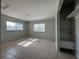 Bright, airy bedroom featuring two windows and tile flooring, providing a comfortable retreat at 502 Canal Dr, Lake Wales, FL 33859