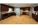 Kitchen featuring dark wood cabinets and tile flooring, ready for a new owner's personal touches and updates at 502 Canal Dr, Lake Wales, FL 33859