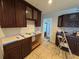 Kitchen featuring dark wood cabinets and tile flooring, ready for customization and design at 502 Canal Dr, Lake Wales, FL 33859