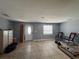 Bright living room featuring neutral walls, tile flooring, and ample space for relaxation and entertainment at 502 Canal Dr, Lake Wales, FL 33859