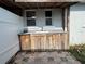 Outdoor sink with wood cabinet and two windows on patio at 502 Canal Dr, Lake Wales, FL 33859