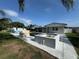 Backyard view of pool and spa with slide, patio, and house at 502 Canal Dr, Lake Wales, FL 33859