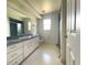 Bathroom featuring a sink vanity and shower with tub at 504 W 7Th St, Frostproof, FL 33843