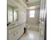 Bathroom with single sink vanity and tub shower combo at 504 W 7Th St, Frostproof, FL 33843