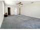 Spacious primary bedroom featuring large windows and plush carpet at 504 W 7Th St, Frostproof, FL 33843