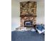 Close-up of the stone fireplace in the living room at 504 W 7Th St, Frostproof, FL 33843